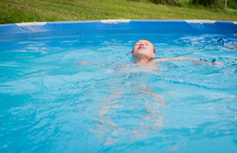a boy in a pool 