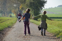 children walking on a park trail 