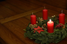 One candle is burning at the Advent wreath for the first advent. 
advent, candle, Christmas, candles, four, three, two, one, lit, light, bright, burn, burning, wreath, birth, Jesus, born, waiting, wait, flame, flames, red, arrive, arriving, come, coming, await, await arrival, arrival, anticipated, anticipate, anticipating, expected, expect, expecting, awaited, long-awaited, hope, hoping, desiderated, longed, longed for, long-yearned-for, crave, desire, long, desiderate, longing, craving, desiring, fir, fir branch, branch, fir-bough, cone, fir cone, pine, pine cone, quiet, time, Christmas story, nativity, nativity story, countdown, count, first, first advent 