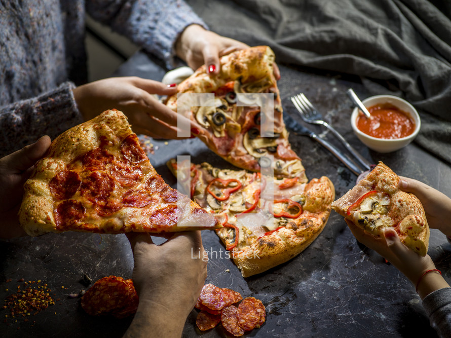 people eating pizza 