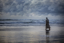 Jesus walking into the ocean 