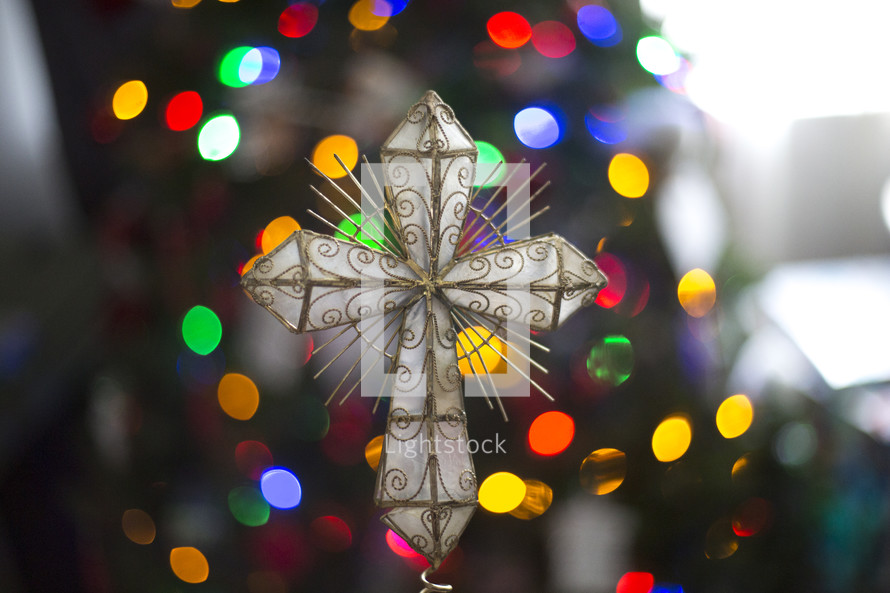 cross ornament on a Christmas tree