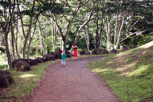 kids walking on a path 