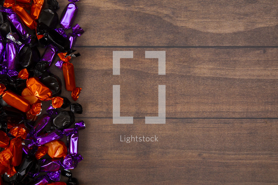 Halloween candy on wood background 