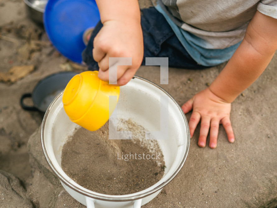 A child playing with sand