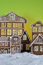 gingerbread village in front of yellow and green