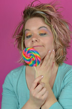woman holding a lollipop 