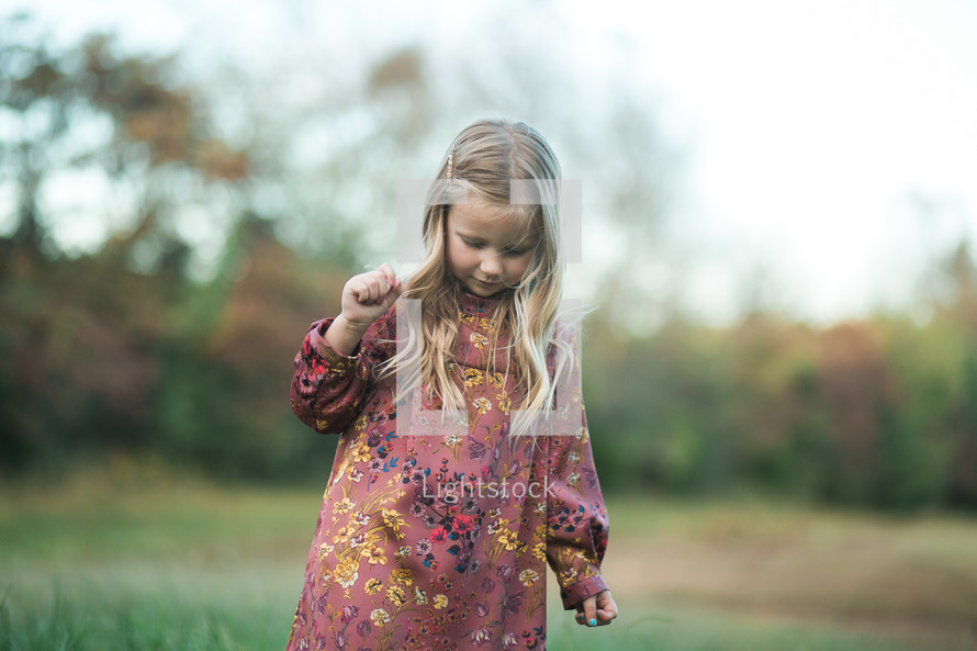 little girl outdoors in fall 