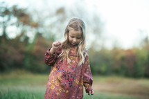 little girl outdoors in fall 