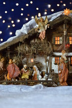 Nativity scene and blue bokeh light background 