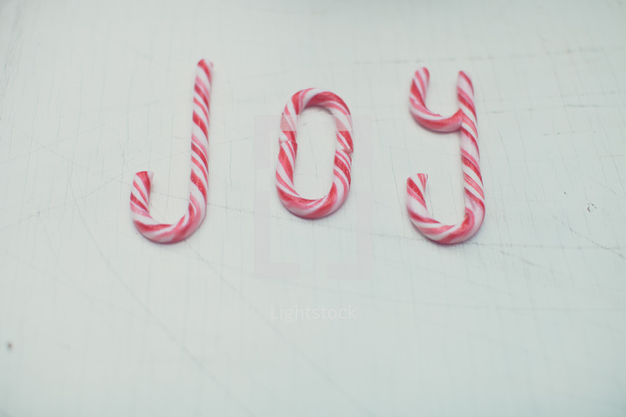 Candy canes spelling out the word, "joy."