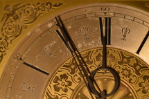five minutes before twelve o'clock at a ancient golden clock.  
late, last minute, scarce, high time, waste, wasting, New Year, clock, watch, year, new, New Year's Day, come, coming, go, going, gone, fading, fleeting, ephemeral, evanescent, time, sliding, fade, slide, New Year's Eve, eve, future, past,  period, era, age, aging, temporary, present, moment, currently, view, prospect, outlook, perspective, vista, lookout, forecast, sluice, briefly, brief, momentary, short-duration, short-period, short-term, short-time, day, date, number, numeral, index, annual, annually, yearly, turn, turn of the year, gold, golden, change, changed, changing, season, seasons, vanish, pass, timepiece, timekeeper, horologe, timepieces, hour, minute, second, hours, minutes, seconds, ticking, tick, chronometry, timing, timer, timers, clockhand, hand, pointers, clock-hand, big hand, little hand, minute hand,  round, circular, circle, circles, orbital, old, ancient, antique