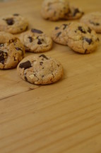 chocolate chips cookies on a wooden board