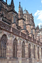 Details of a Gothic cathedral.
cathedral, old, Gothic, Gothic age, Gothic style, Gothic period, gothically, Europe, sandstone, freestone, brownstone, ogive, pointed arch, tower, exterior, church, roof, steeple, spire, high, copper roof, copper, flying buttresses, tall, slim, slender, gargoyle, waterspout, spout, figure, statues, jamb statues, sky, clouds