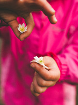 a child holding flowers 