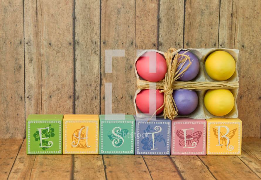 Easter sign of wood blocks and Easter eggs 