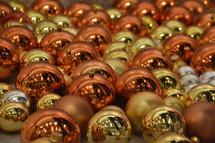 gold, silver, and copper Christmas ornaments 