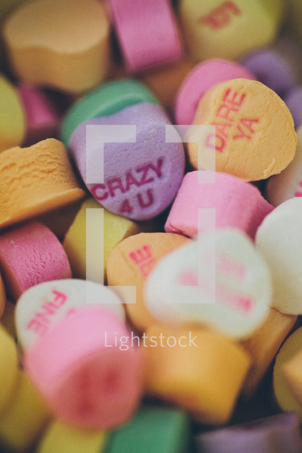 pile of candy conversation hearts for Valentine's Day 