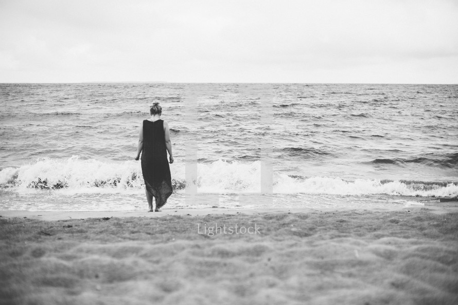 woman standing on a shore 