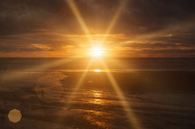 sunburst over a beach 