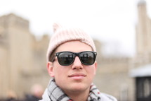man with sunglasses and wool cap 