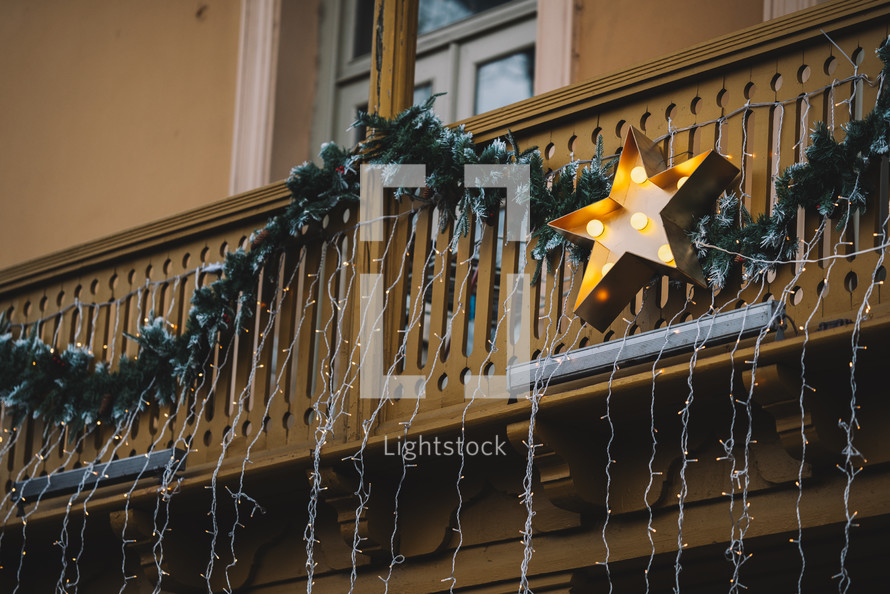 Star-shape Christmas decorations on a balcony