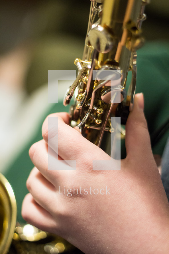 kid playing a saxophone 