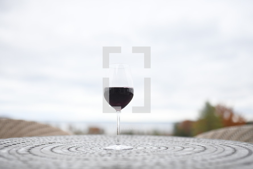 wine glass on an outdoor table 