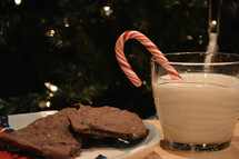 candy cane in milk and cookies 