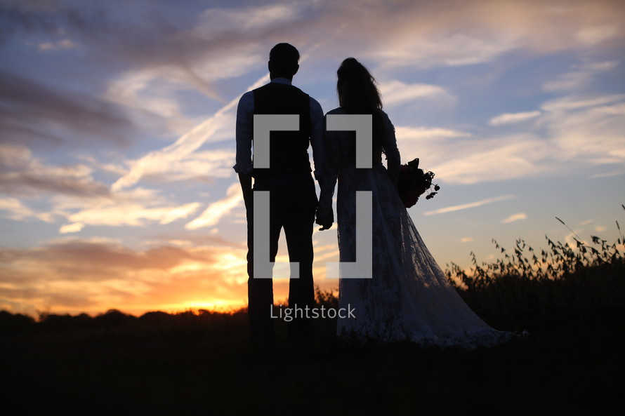 silhouette of a bride and groom 