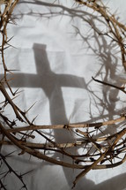 cross shadow and crown of thorns on white cloth