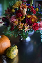 flower arrangement and pumpkin