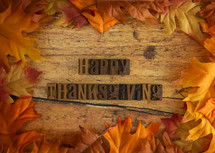 Happy Thanksgiving Background with Bright Orange and Red Autumn Leaves