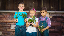 Kids Holding Plants