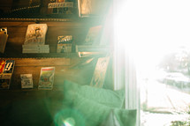 bright sunlight shining into a room with book shelves 
