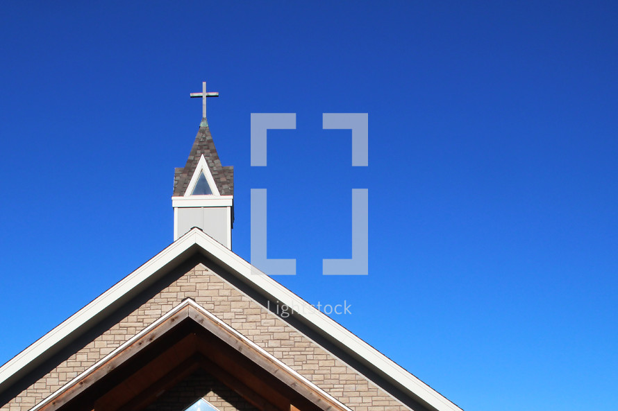 a church steeple against a cobalt blue sky 