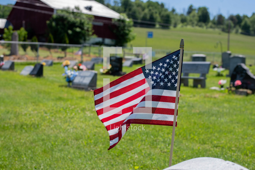 American flag at a cemetery 
