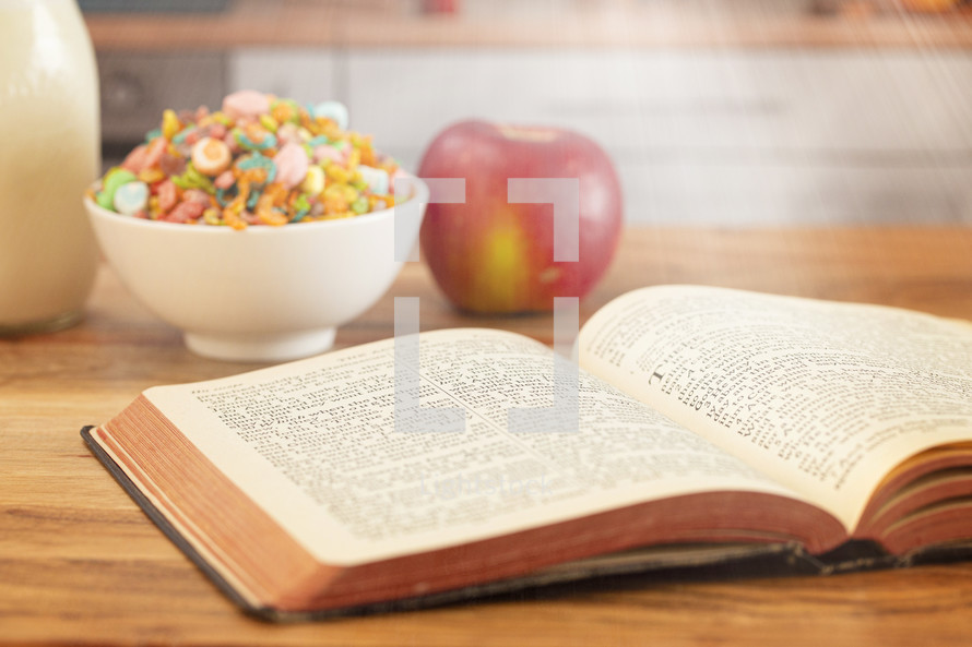 A Bible on a Wooden Table with Breakfast Set a Perfect Way to Start Your Day