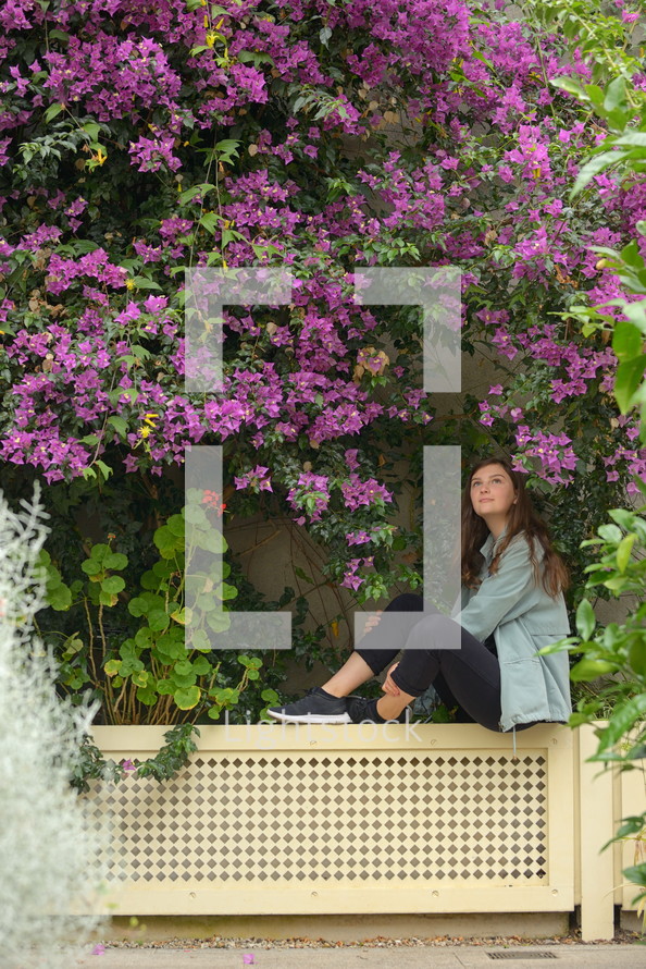 teen girl portrait and bougainvillea flowers in botanical garden