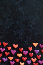 border of hearts on a black background 