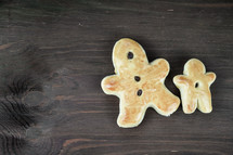 baked raisin bread in the shape of a gingerbread man 