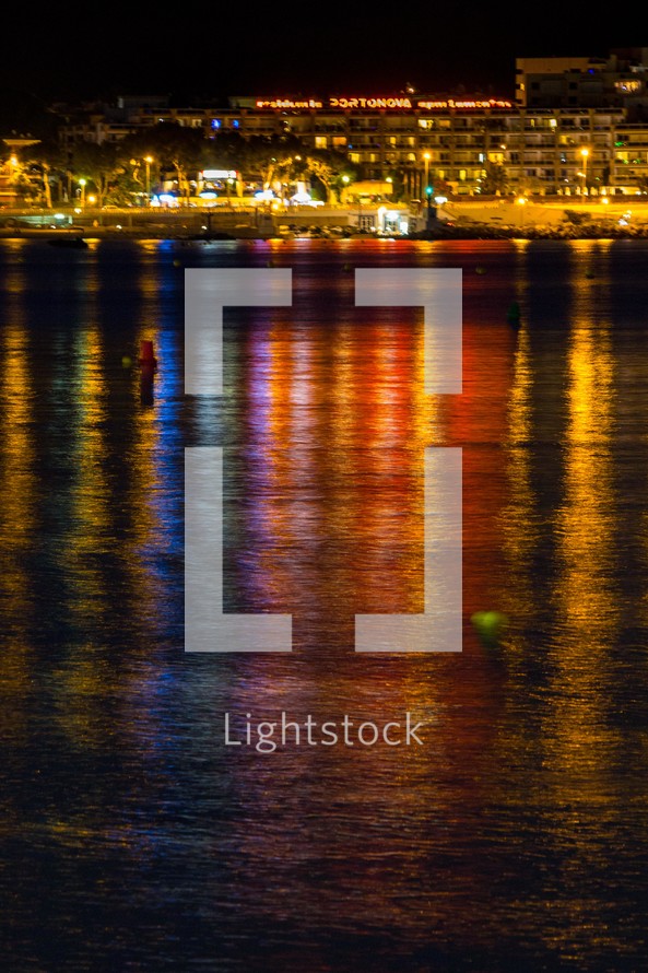 reflection of lights from a city on water 