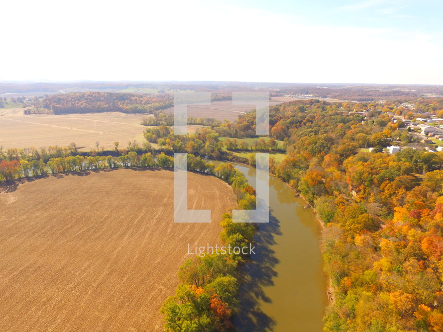 aerial view over a rural river in fall 