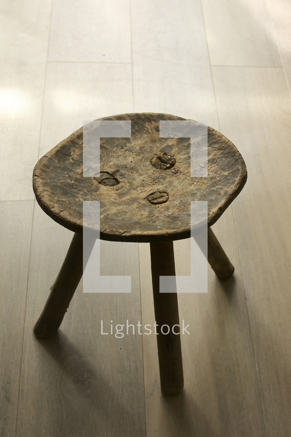 wooden stool on a wood floor 