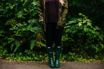 a woman wearing rain boots 