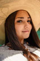 portrait of a young woman in a sunhat 