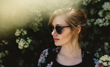 a side profile of a woman in sunglasses 