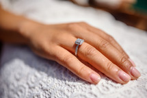 enagement ring on a woman's finger 