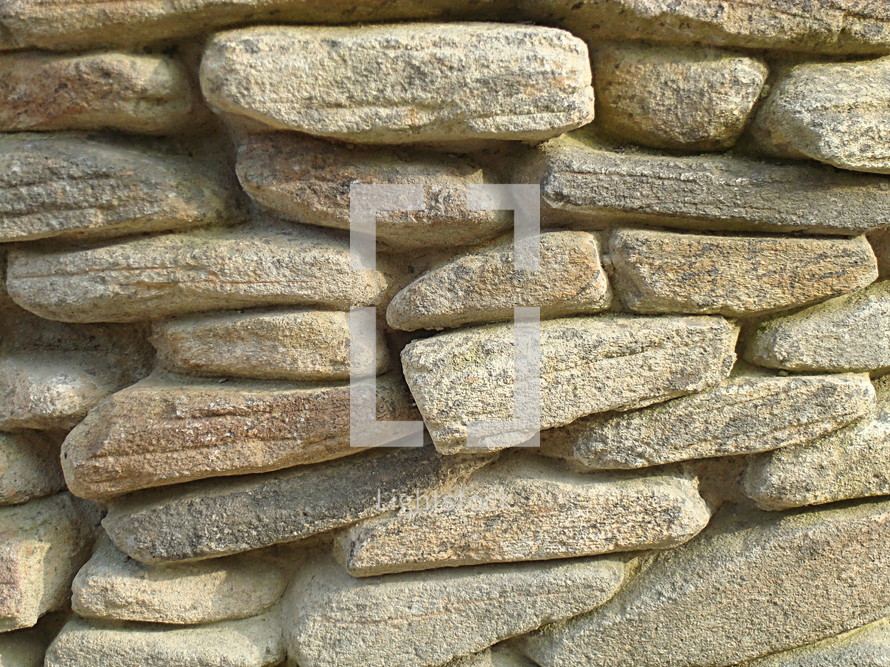 Wall out of stones. 
