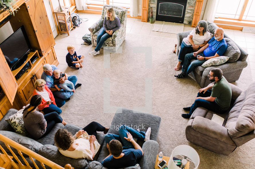 fellowship of families in a home for a prayer meeting 